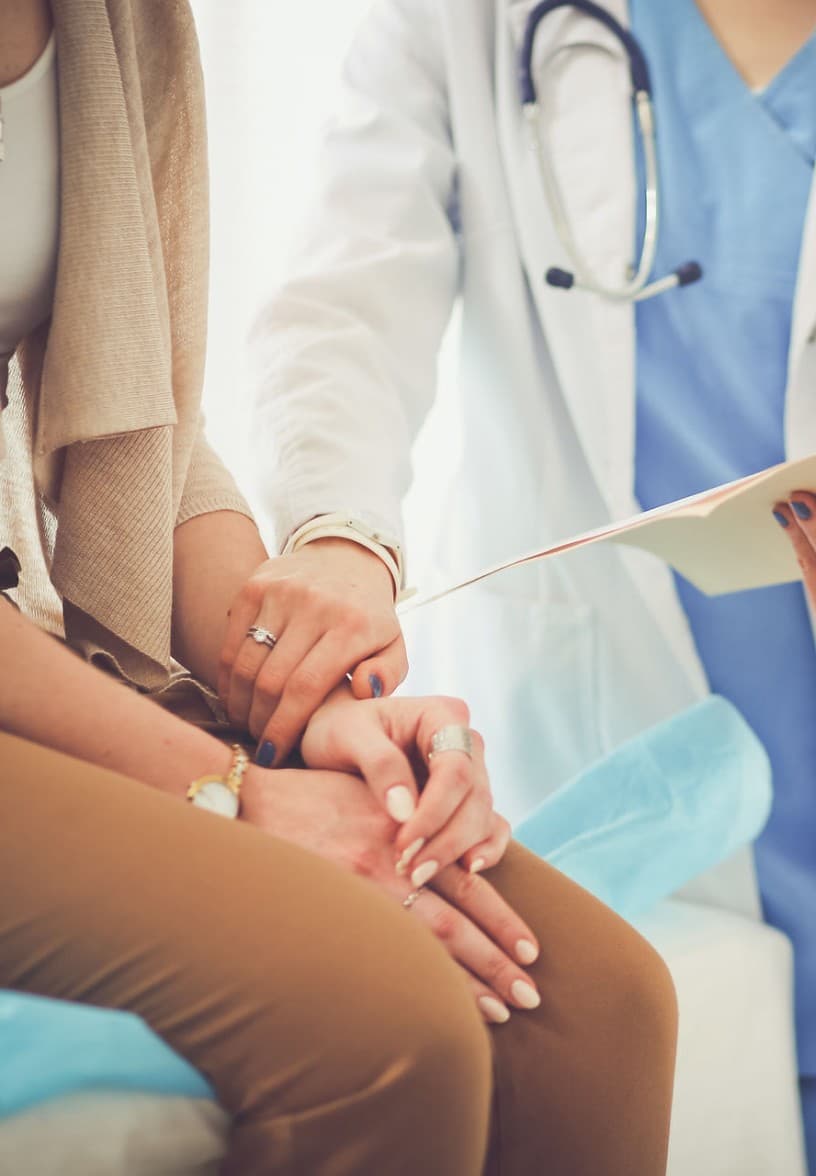 A Laguna Cardiology clinician reviewing a patient's chart with her